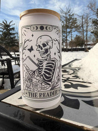 16 oz frosted glass can cup with skeleton reading design and bamboo lid, perfect for book lovers and gothic aesthetics