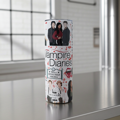Mystic Falls Inspired 20oz TumblerSip in supernatural style.This 20oz stainless steel skinny tumbler is covered in aesthetic fan-art graphics, faceless characters, iconic references, quotes, crows, b